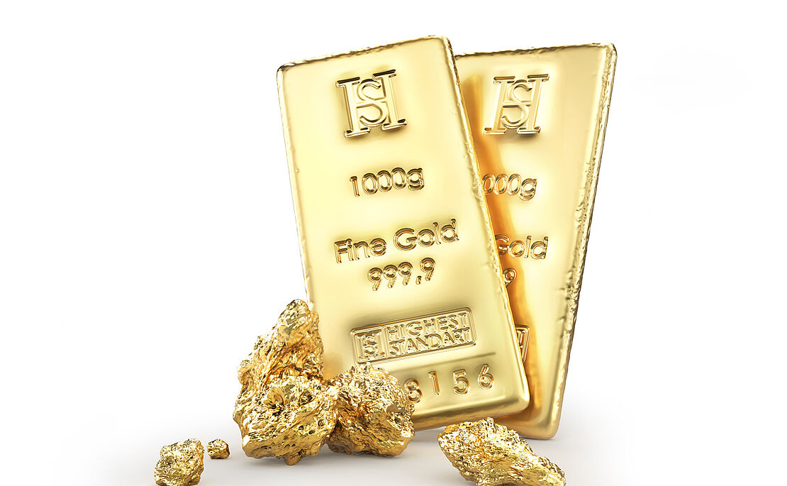 Zwei Goldbarren und ein paar Gold-Nuggets